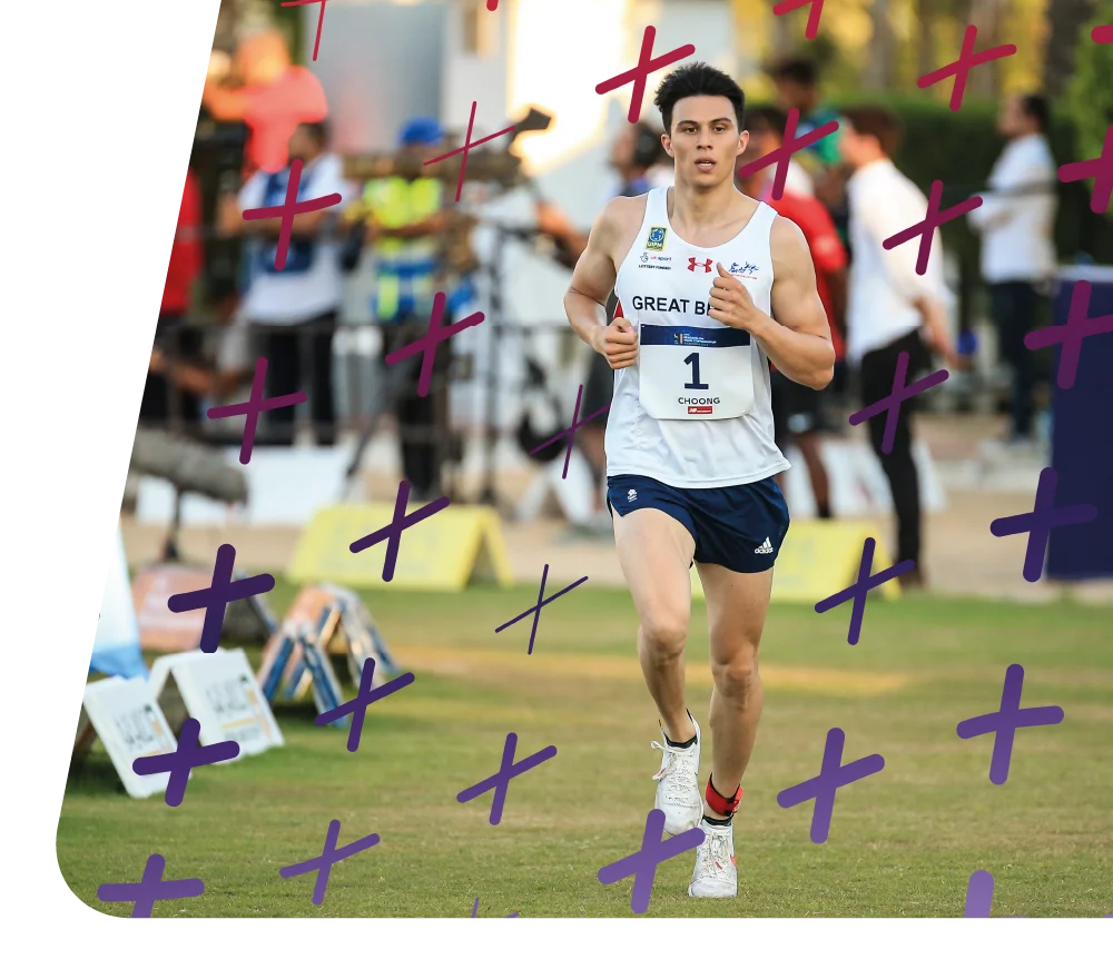 Joe Choong running in a modern pentathlon event, wearing a Great Britain jersey with the number 1